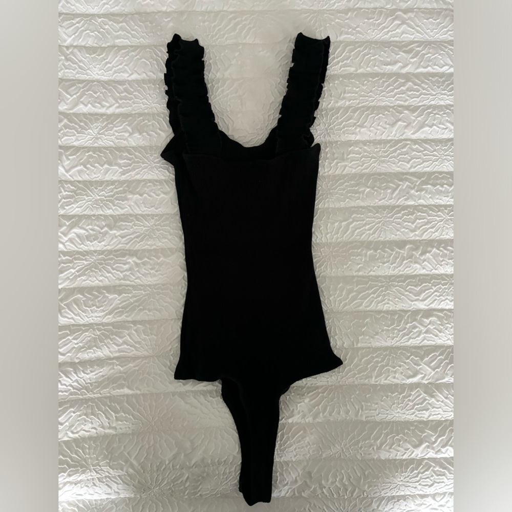 Francesca’s black ribbed bodysuit